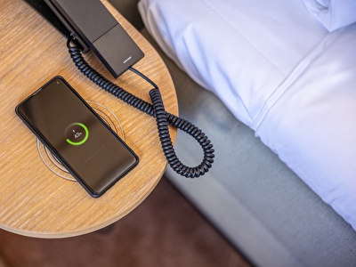Spacious and luxurious Junior Suite with wireless charging in bedside table in Notiz Hotel Leeuwarden