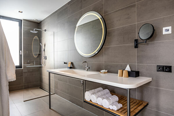 Luxurious Junior Suite bathroom with rain shower and luminous mirror Notiz Hotel Leeuwarden